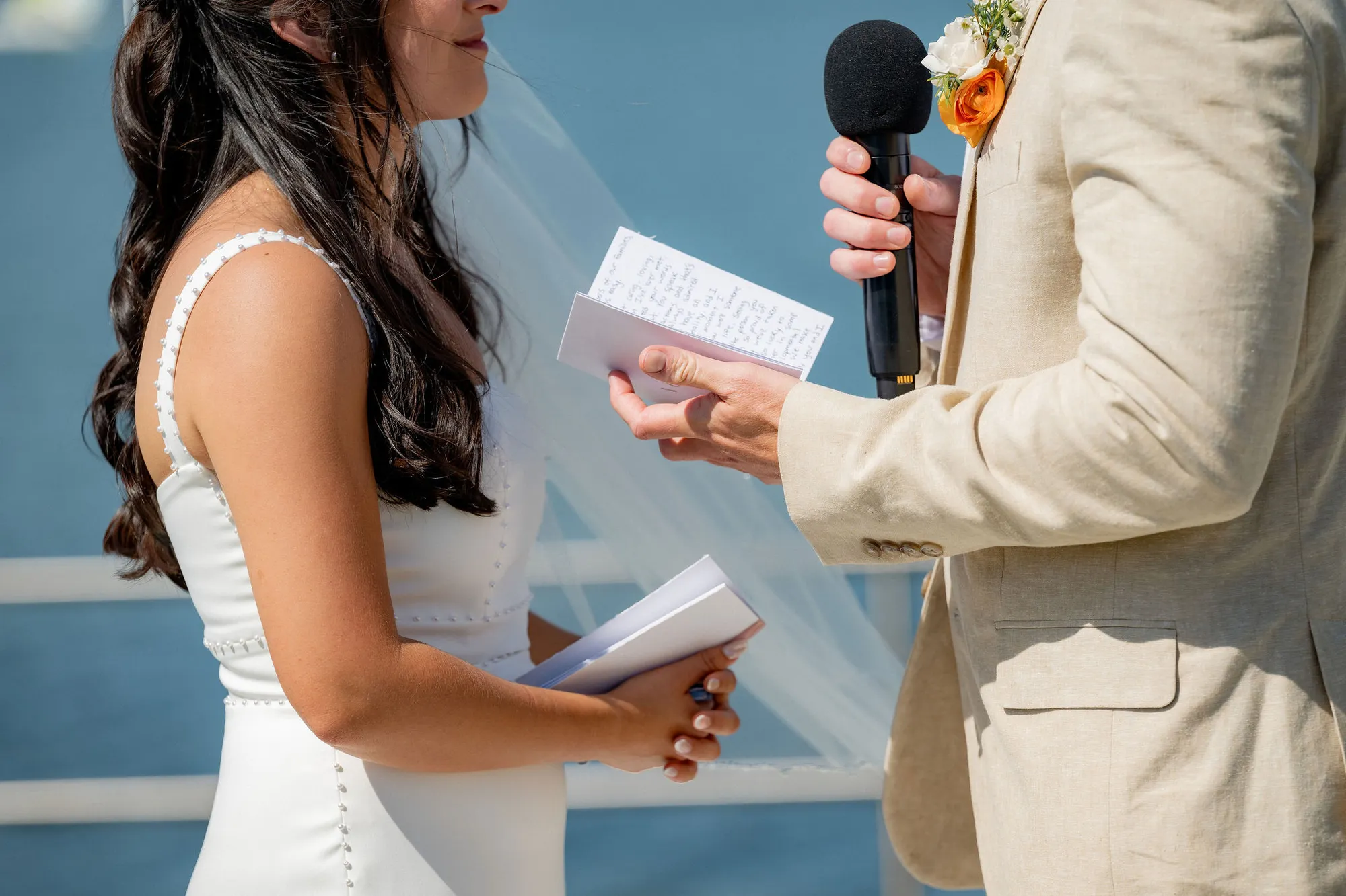 Groom reading his vows during a bayfront San Diego wedding ceremony
