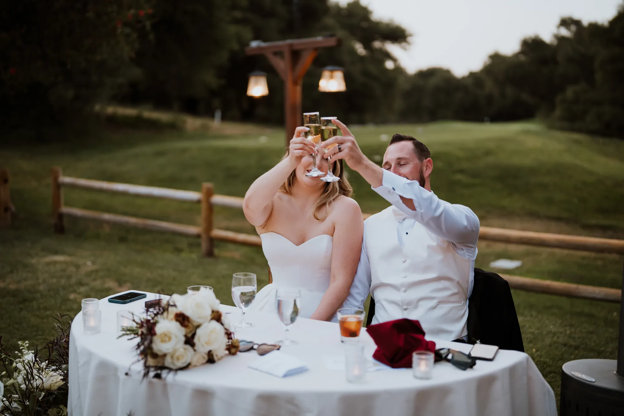 Couple toasting at their wedding reception