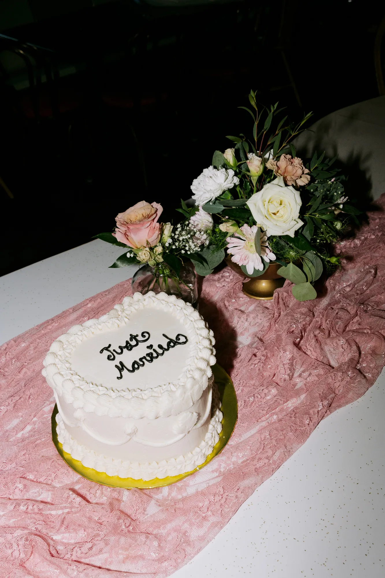 Pink wedding cake and bridal shoes